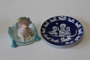 A 1974 Royal Copenhagen Mother's Day plate, 15cm, together with a bisque figure modelled as a bonnet