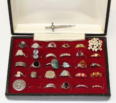 A collection of silver and costume rings, comprising 66.4gm of silver and stone set rings