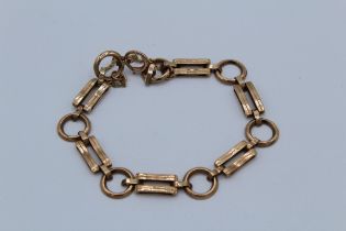 A 9ct rose gold bracelet of alternate hoop and gate links