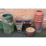 Two Doulton stoneware drain hoppers, a terracotta chimney piece and a two section cylindrical