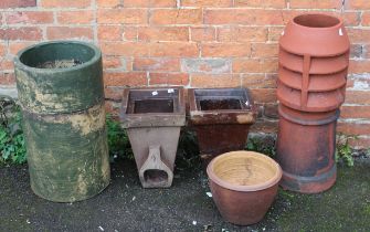 Two Doulton stoneware drain hoppers, a terracotta chimney piece and a two section cylindrical