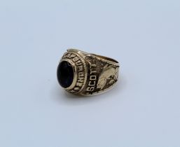 An American class ring for South Lafourche High School. set with blue paste and dated 1990 with