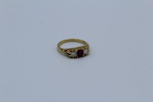 A ruby and diamond three stone ring, 4.0gm approximately