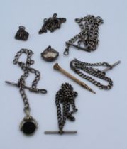 A collection of silver and white metal Albert watch chains along with a blank seal fob, a