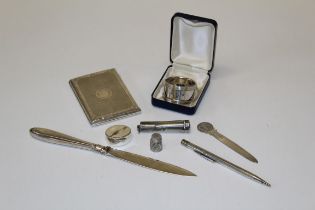 A collection of small silver items, including an engine turned cigarette case, thimble, Eversharp