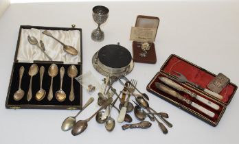 A small quantity of silver and white metal items, including an 85 gm ingot, Middle Eastern cup,
