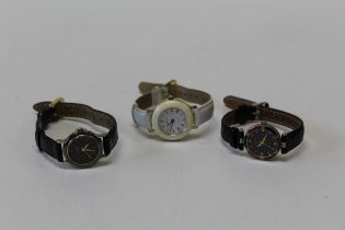 Two late 20th century Must de Cartier lady's quartz wristwatches, together with another, the dial