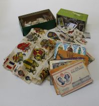 A collection of several hundred cigarette and tea cards, loose and some in albums, together with