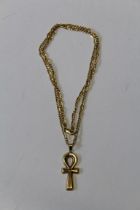 A 9ct gold cross, suspended from a gold chain stamped 750. Cross weight 4gm, chain weight 8gm