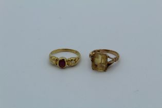 An 18k ruby and diamond ring and a 9ct ring set citrine