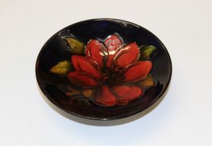A scarce 1960's Walter Moorcroft Dahlia pattern footed bowl, tube line decorated with a bold red