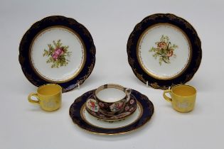 Three early 20th century Coalport florally decorated dessert plates, each with bleu de Roi border,