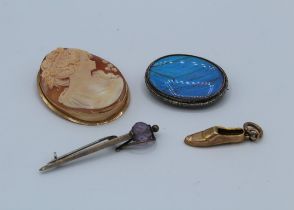 A collection of jewellery featuring a 9ct cameo brooch, a 9ct charm, 1.0gm plus a silver butterfly