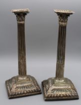 A pair of loaded sterling silver Corinthian column design candlesticks. Marked for Emick Romer,