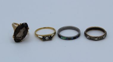 A collection of dress rings featuring an 18ct gold diamond and sapphire modernist ring, size U 1/