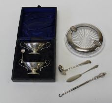 A cased, matched pair of silver navette form twin handled salts, a presentation silver mounted