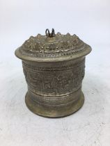 An Indian white metal lidded jar. H:8.5cm