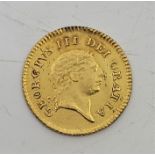 A George III 1806 third-guinea gold coin, second laur.head, rev. crown, gade as per images.