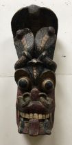 A large Indian carved wooden mask. H:55cm