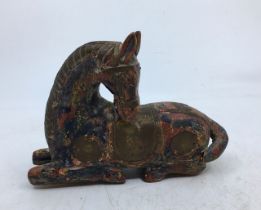 A Chinese carved wooden horse. H:12cm