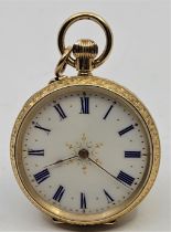 An early 20th century Swiss 18ct. gold open face pocket watch, crown wind, having white enamel