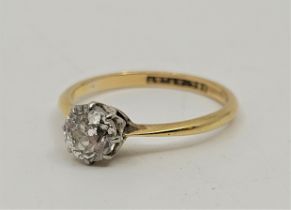 An 18ct. yellow gold and platinum diamond solitaire ring, set old-cut diamond (EDW 0.75 carats),