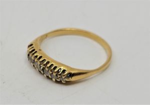 A late 19th century precious yellow metal seven stone diamond ring, set seven graduated old-cut