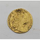 A George III 1762 quarter guinea gold coin, obv. Laur.head, rev. crowned shield, grade as per