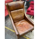 A mid century leather armchair