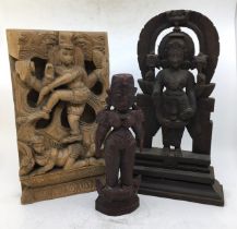 A collection of three Indian carved wooden figures. H:34.4cm (tallest)