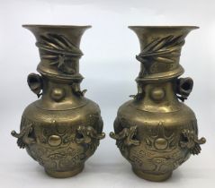 A pair of  Chinese bronze vases, together with a similar bronze vase. H:25cm (3)