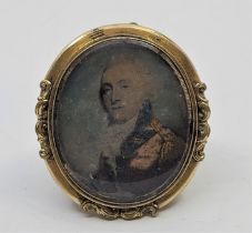 A 19th century oval mourning pendant/brooch, the front with bust length miniature portrait of a