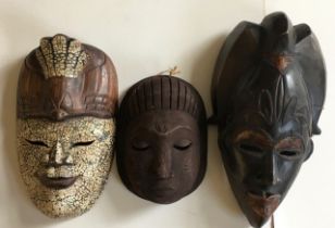 A collection of 3 African wooden masks (3) H: 41cm (largest)