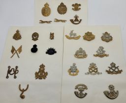 A collection of British military cap badges, various dates and regiments. (29)