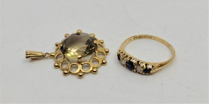 An 18ct. gold, sapphire and diamond ring, set three graduated mixed round cut sapphires