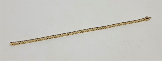 A 14ct. yellow gold diamond line bracelet, set eighty-five round brilliant-cut diamonds (ETDW 2.25