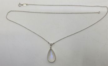 An Italian 18ct. white gold, moonstone and diamond pendant necklace, the fine link 18ct. white