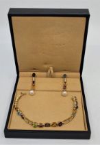 A Bulgari "Allegra" 18ct. gold, multi gem and diamond set bracelet and drop earrings en suite, the