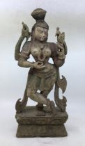 A Indian carved wooden figure of a deity. H:46.6cm