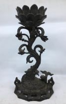 An Indian bronze candlestick. H:33cm