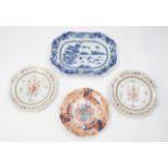 A pair of 18th Century Chinese porcelain famille rose octagonal Armorial plates, the centres with