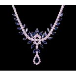 A sapphire and diamond 18ct white gold collar necklace, comprising a decorative floral stone set