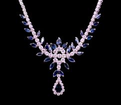 A sapphire and diamond 18ct white gold collar necklace, comprising a decorative floral stone set