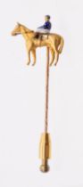 Equestrian interest: a novelty enamel and 9ct gold stick pin, modelled in the form of a horse and