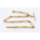 A Victorian 18ct gold trombone link Albert chain, width approx 7mm, each link marked, T bar and