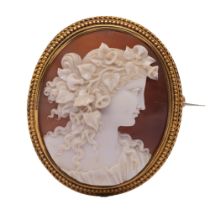 A fine 19th century gold set cameo brooch, comprising an oval carved shell cameo depicting a