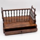 A Regency rosewood desk stand, turned gallery support with twin handles, the single drawer with