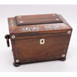 An early 19th Century rosewood inlaid mother-of-pearl tea caddy, sarcophagus shaped with ring