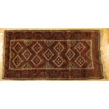 A Kurdish wood run, handwoven, dark green, brown and red ground decorated with central medallions,