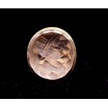 An early 19th century intaglio gold ring, comprising an oval carved rock crystal depicting a